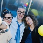 Drunk business people celebrating in the elevator